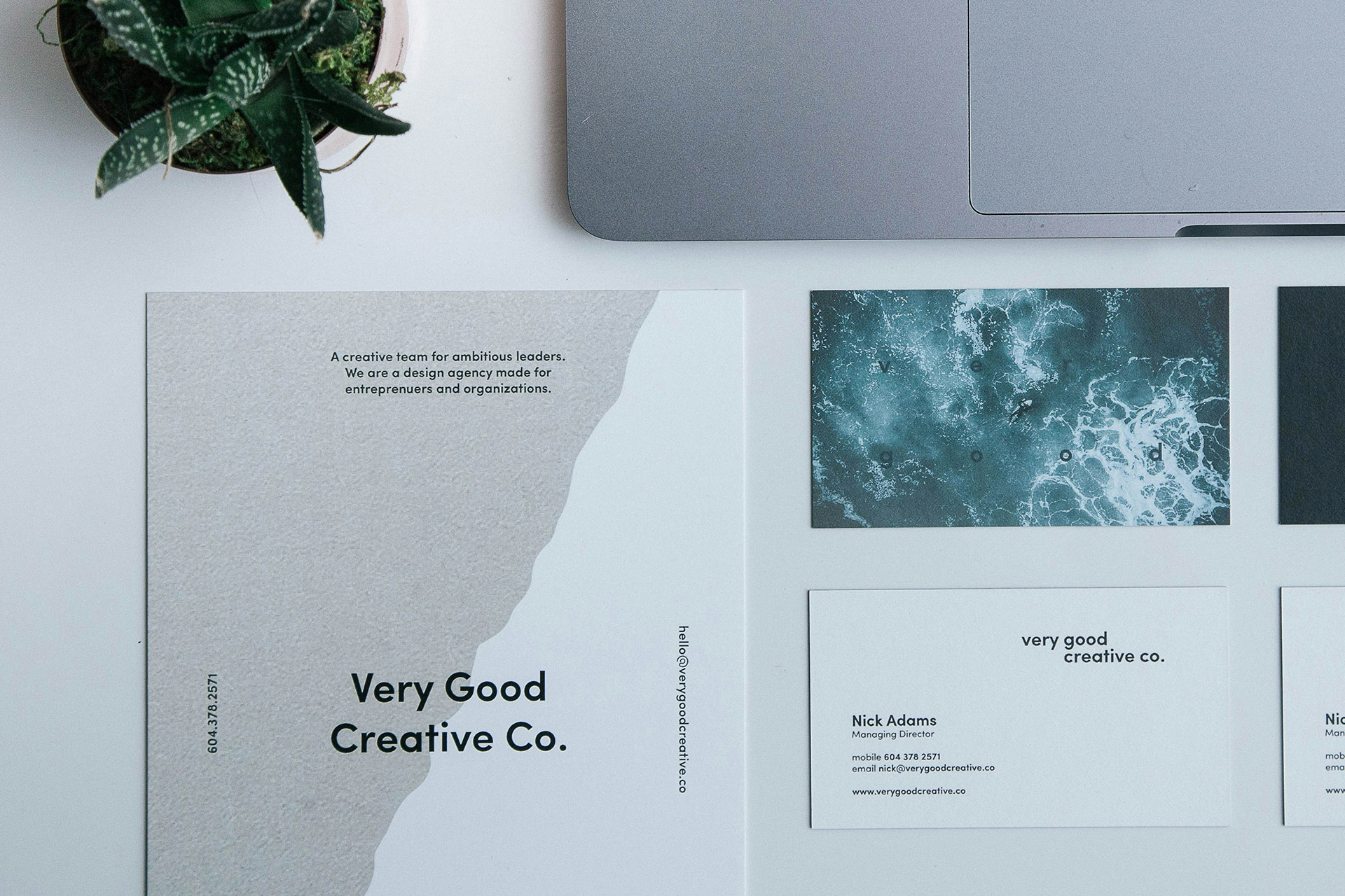 Modern branded stationery and business cards displayed on a desk, showcasing custom design options for business card printing in Calgary.