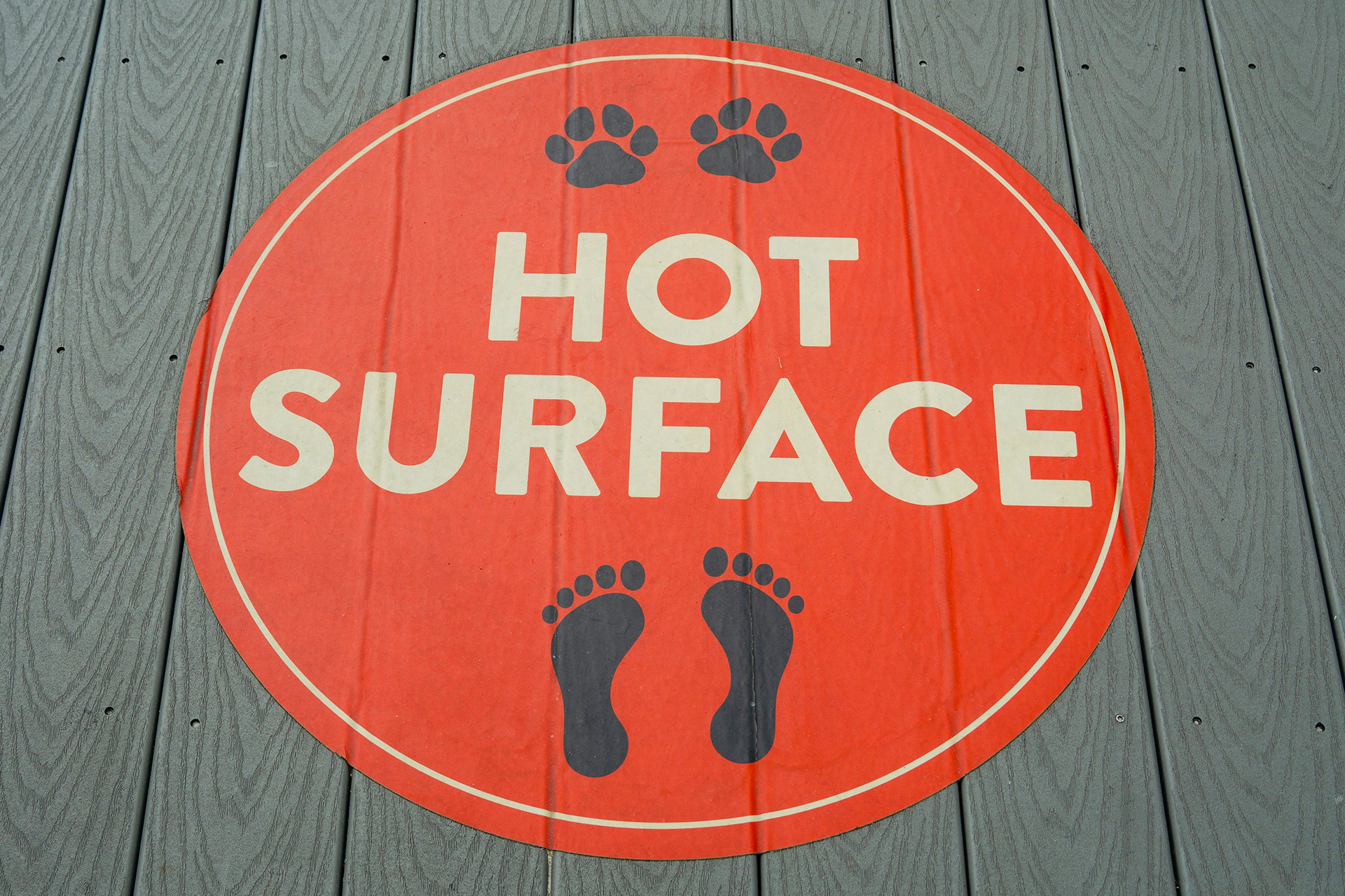 Humorous floor decals in Calgary reading hot surface, designed for clear visibility in public.